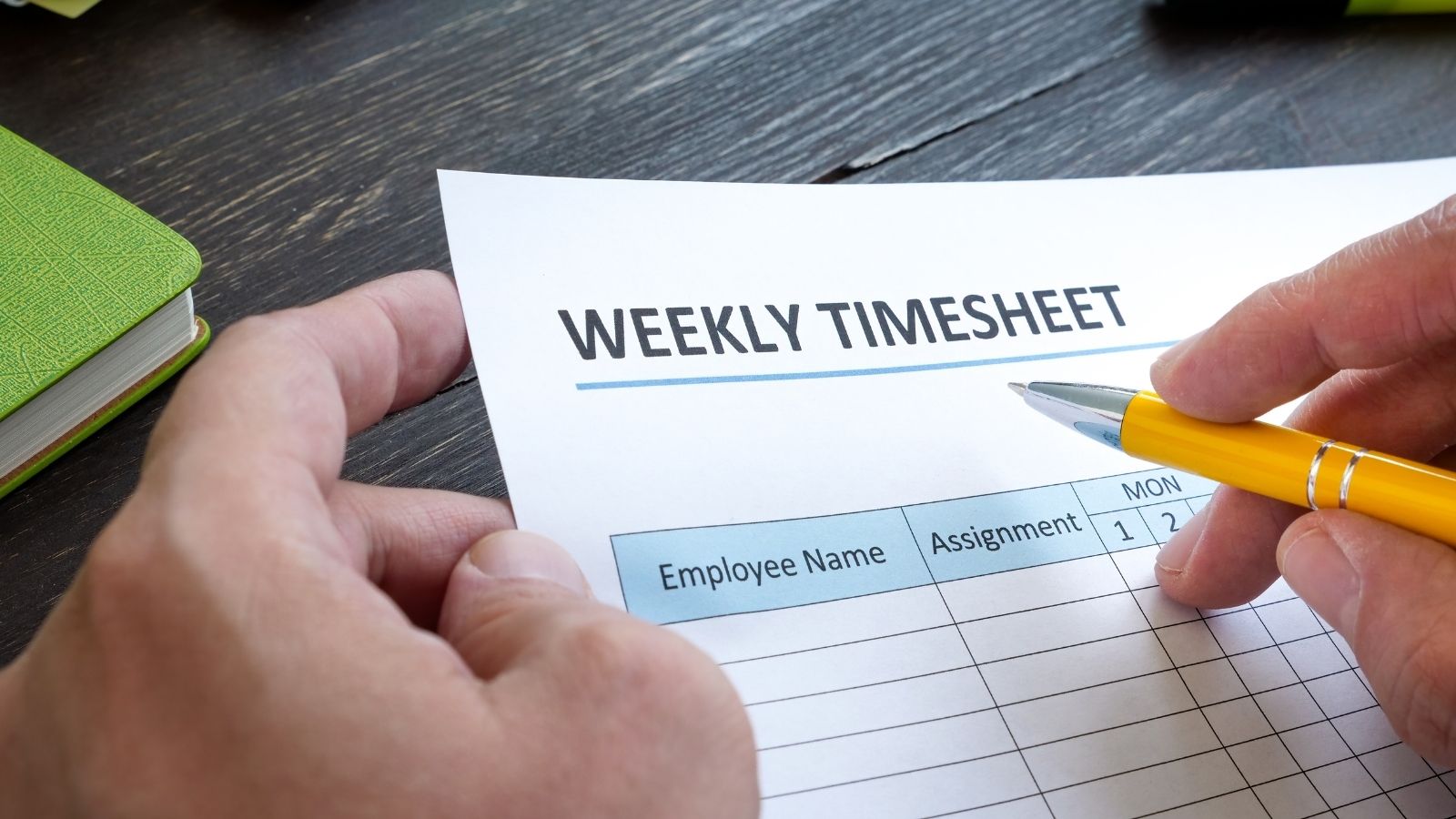 Salesmen Were Switched To Hourly Pay—So One Employee Started Claiming Overtime employee filling out a timesheet