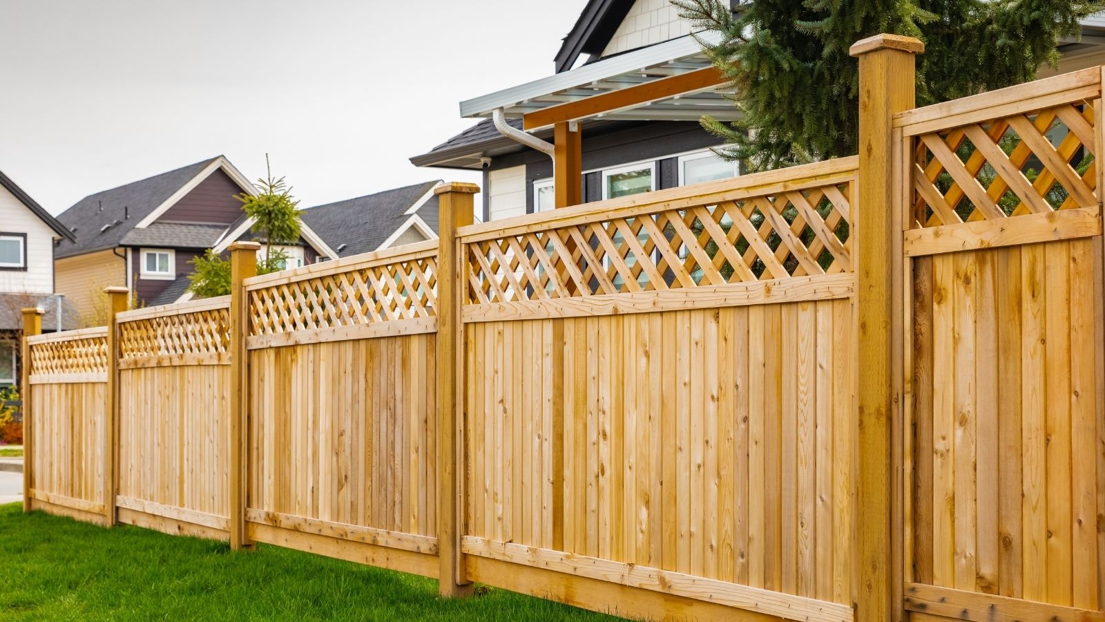 wooden fence surrounding a house
