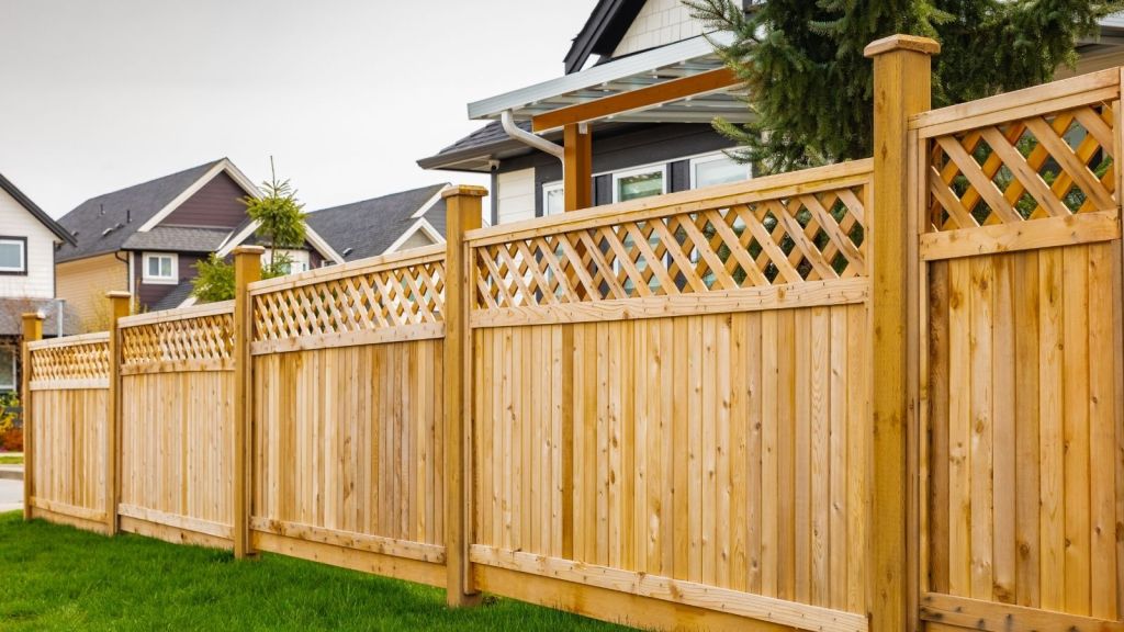 wooden fence surrounding a house