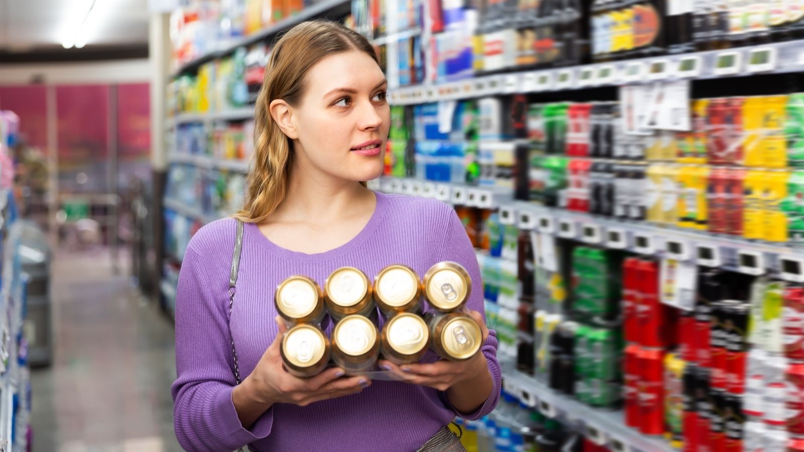 I Only Asked How Her Day Was: Cashier Stunned as Customer Breaks Down at the Counter woman buying beer