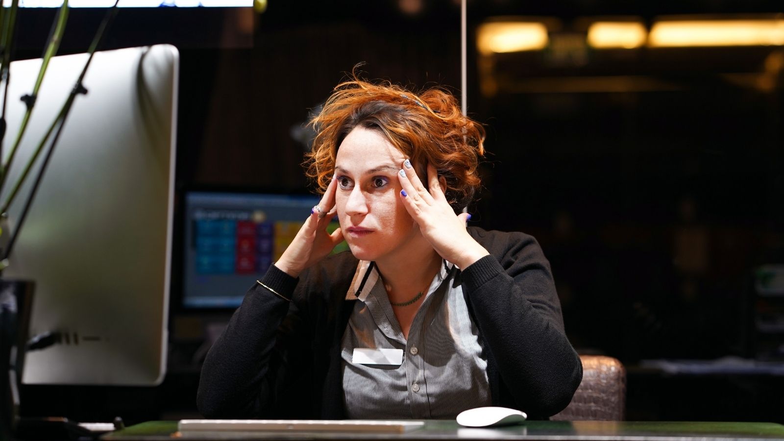 hotel front desk worker looking stressed out