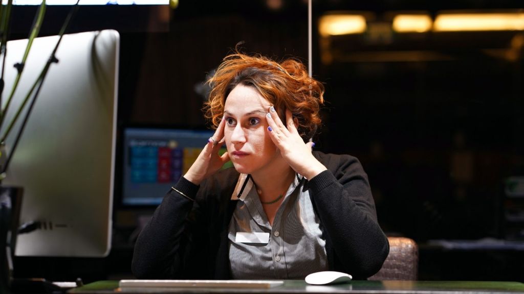hotel front desk worker looking stressed out