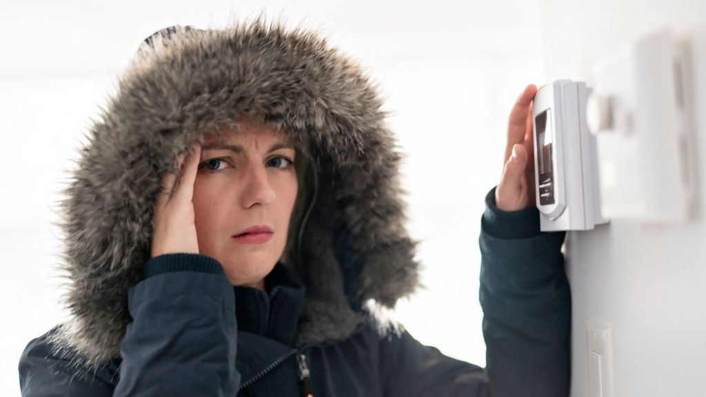 woman wearing a winter coat inside