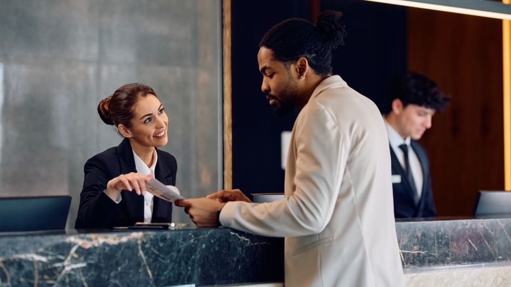 man checking into a hotel