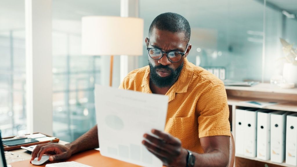 man reading document