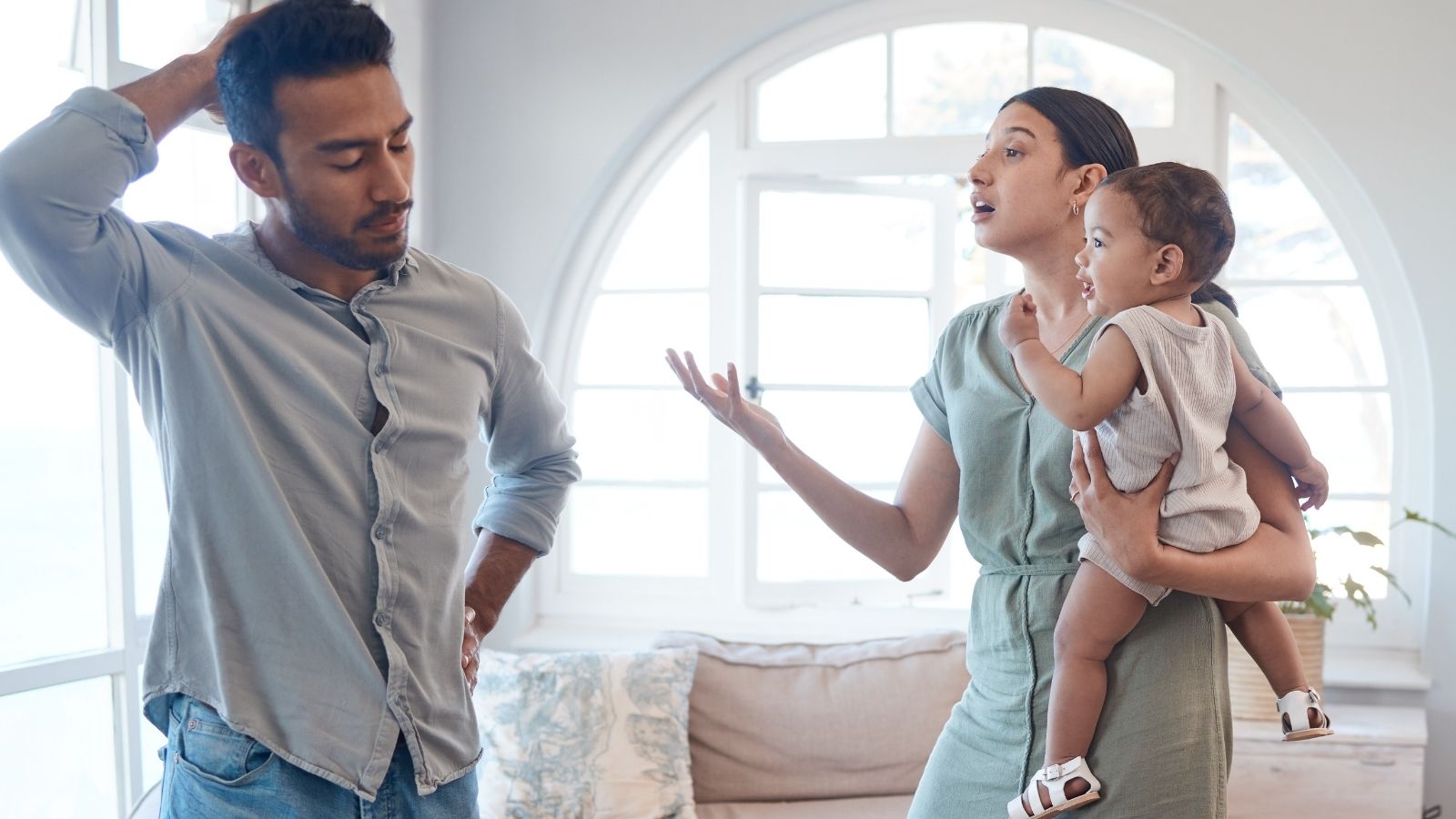 He Moved Into His Girlfriend’s House, but Refused to Help Pay for a Nursery Addition for Their New Baby couple with a baby arguing
