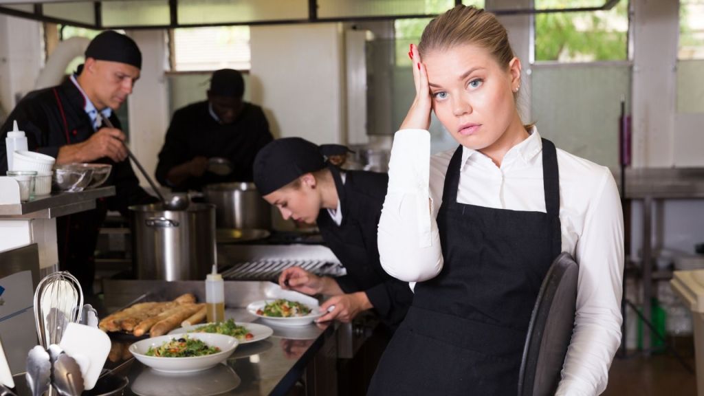 upset waitress in restaurant kitchen