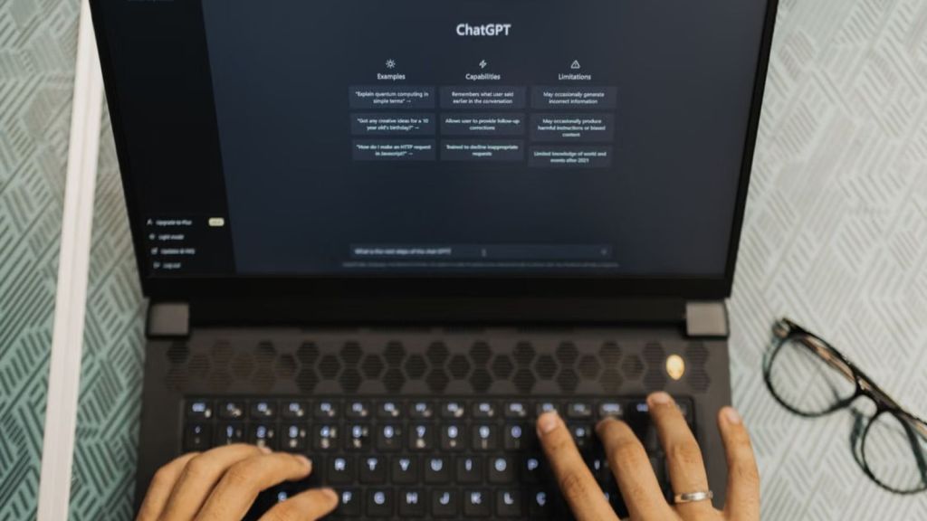 Woman using ChatGPT on her laptop