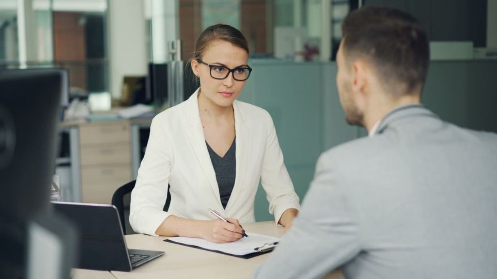 Man in business attire attending a job interview