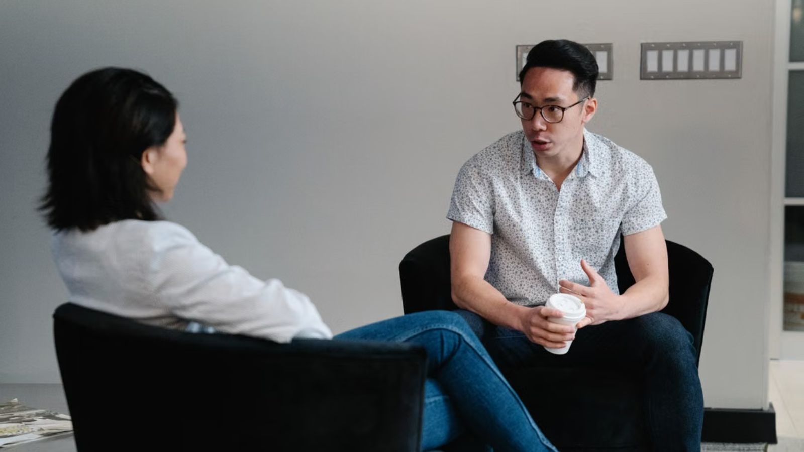Colleagues talking to each other about a serious matter in the office