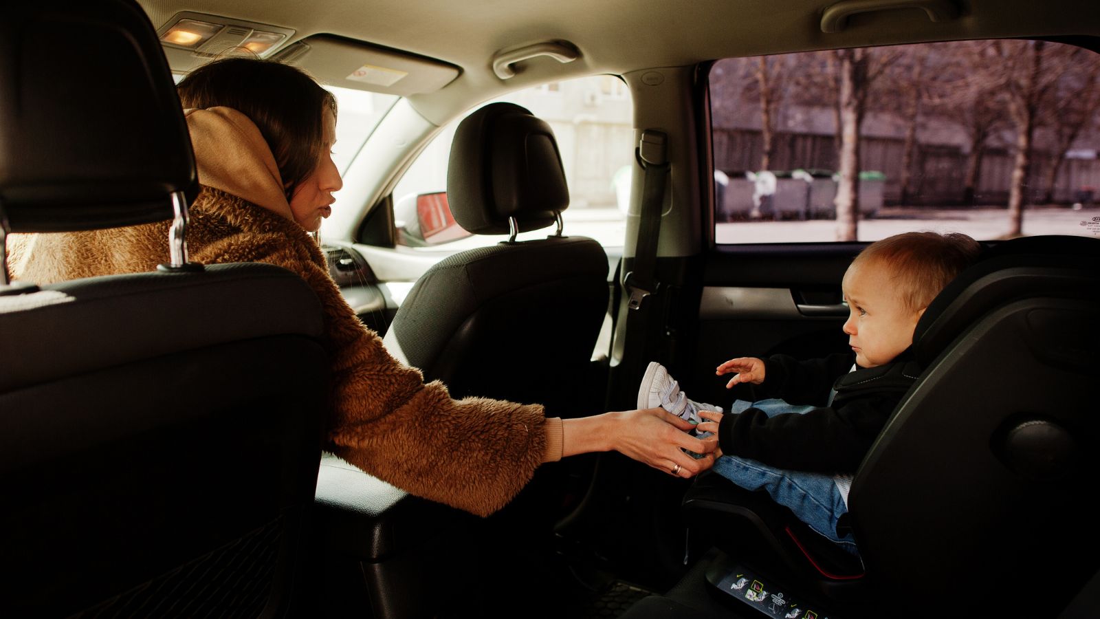 After Their Car Broke Down, His Wife Wanted to Buy a New One—But He Refused and Insisted They Share a Single Vehicle Instead, Setting Up a Real Test of How Well That Would Actually Work Mother and child in baby seat inside the car