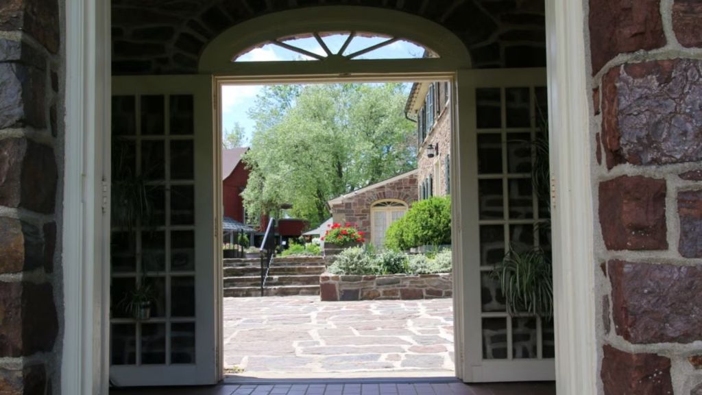A widely open set of doors showing a lovely view outdoors