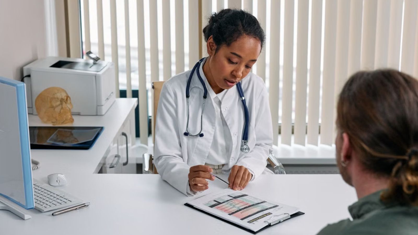 His Employer Demanded a Doctor’s Note—So He Got One and Started Taking All the Sick Days He Wanted Doctor filling out a form while talking to a patient