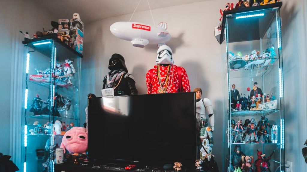 The inside of a room filled with toys, collectibles, and a TV