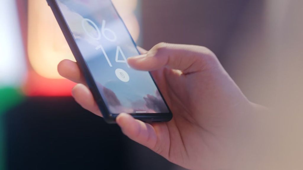 Person logging in to his phone through biometrics