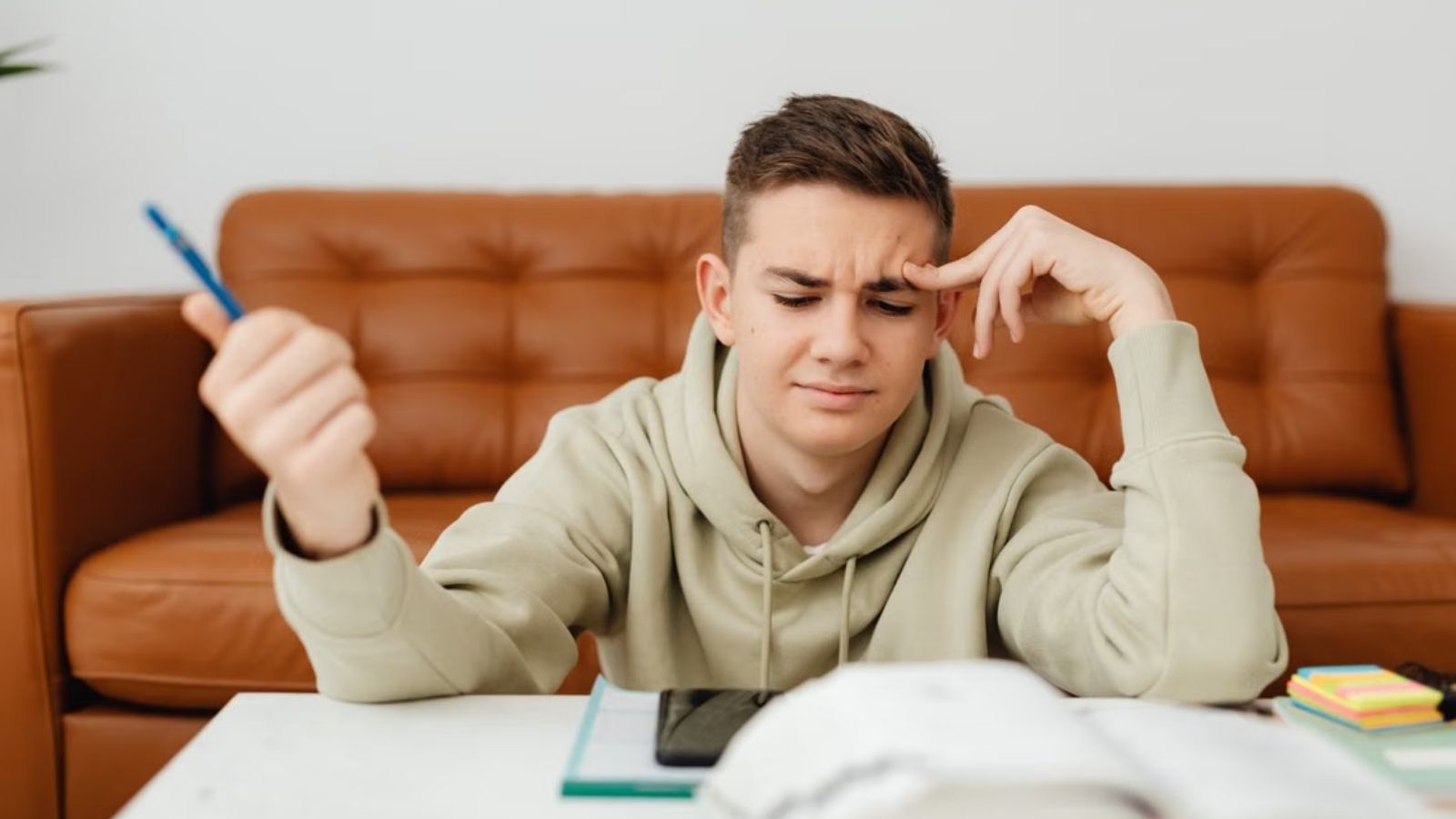 He Helped His Nephew Fix a Math Worksheet—Then His Brother Accused Him of Undermining His Parenting Teenage boy having a hard time doing his homework