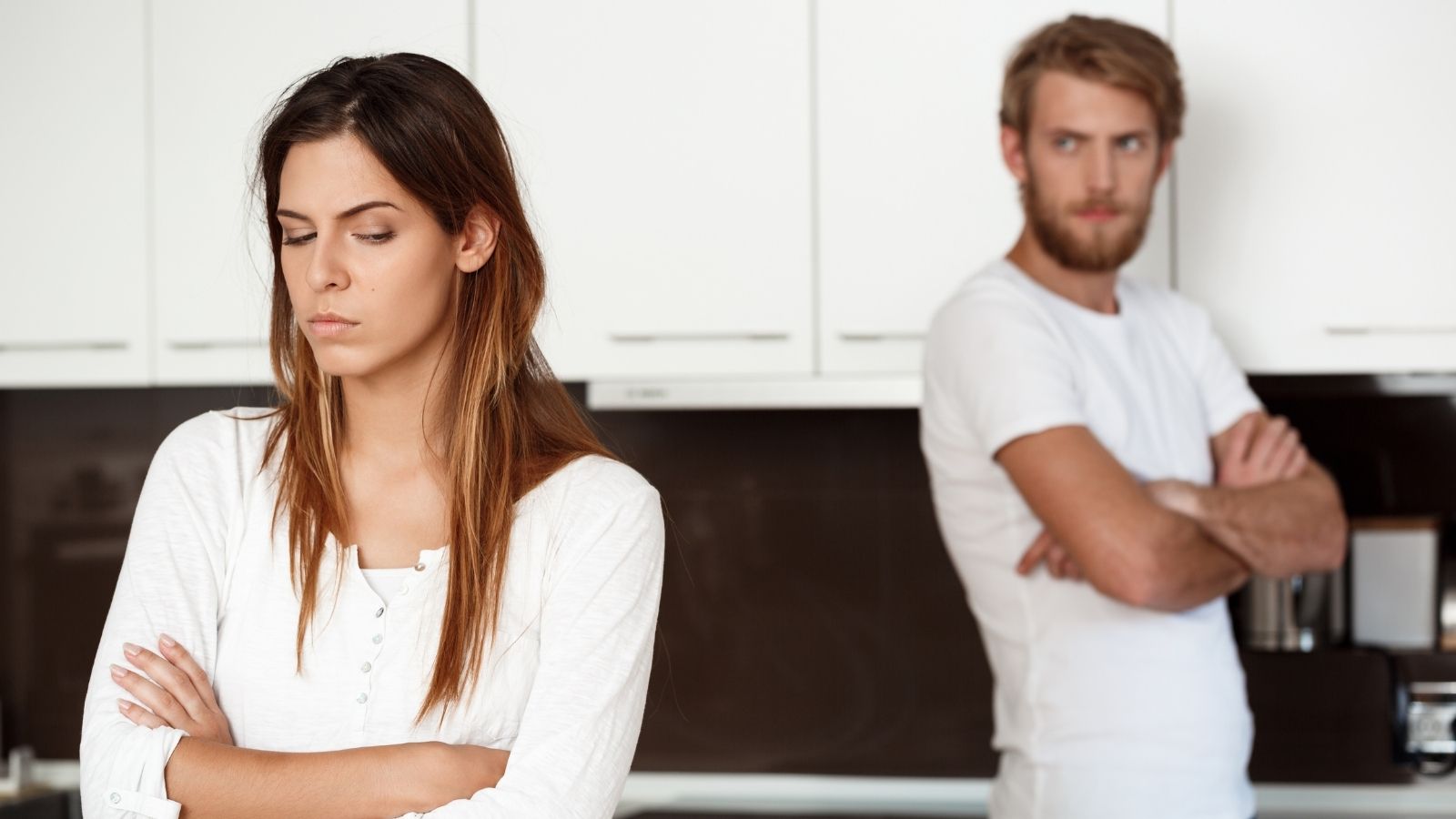 Four Straight Weekends of Family Visits Down Under Led to an Ultimatum: His Partner Banned His Daughter From Their Shared Home Man and woman silently arguing in the kitchen