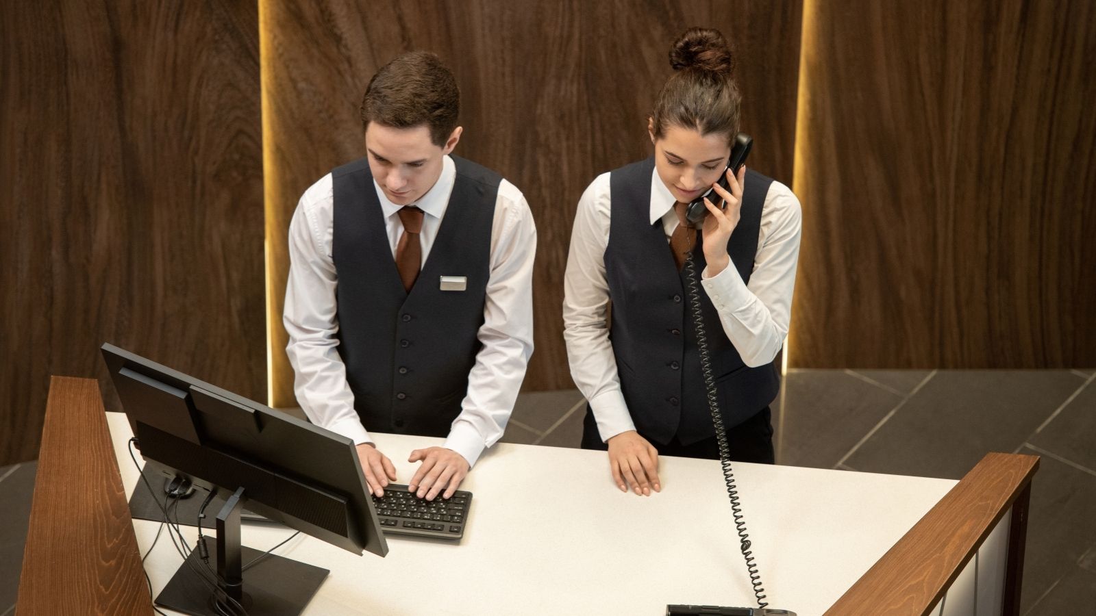 A Hotel Guest Left Cash in the Front Desk Safe—Then Came Back Claiming Some of It Was Missing two front desk workers at a hotel