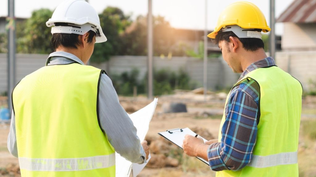 builder and engineer at a construction site