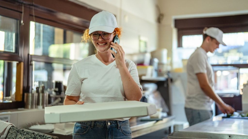 woman working at a pizza place