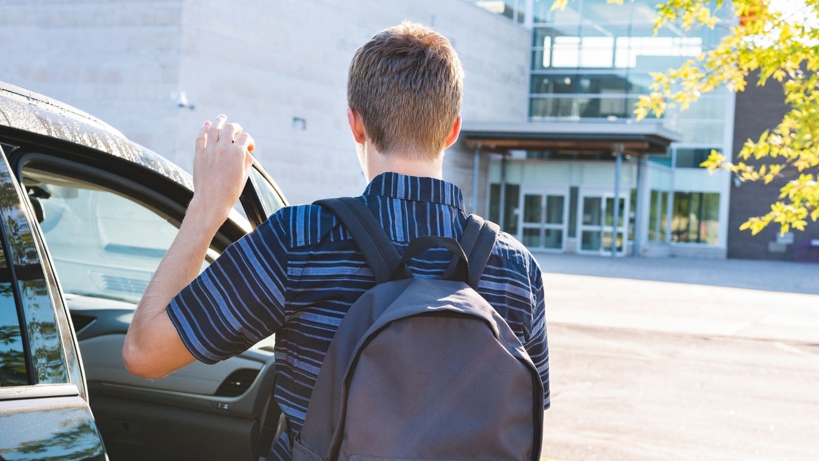 He Drives Himself to School Every Morning, But Refuses to Give His Neighbor a Ride Along the Way—And Now Hes Facing Pressure From Both Families to Explain Why teenage boy closing the car door at school
