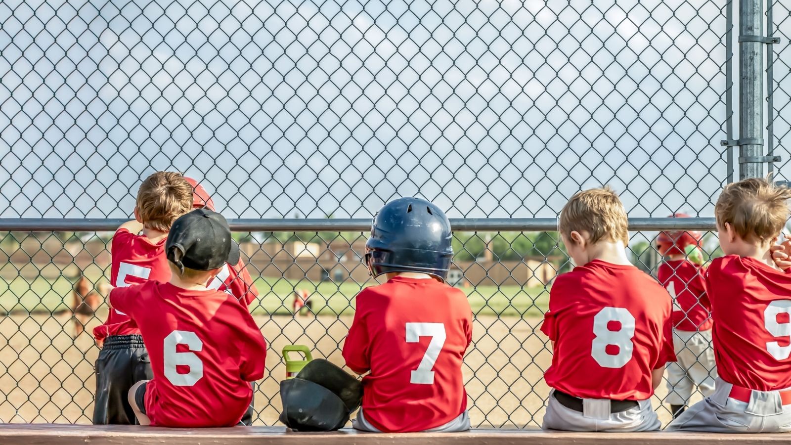 little boys in baseball uniforms