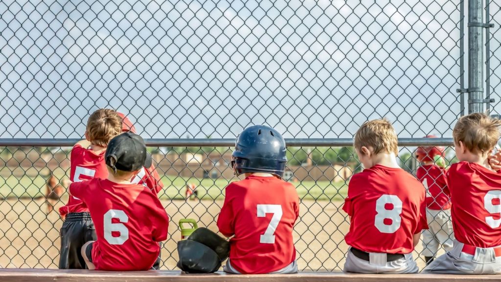 little boys in baseball uniforms