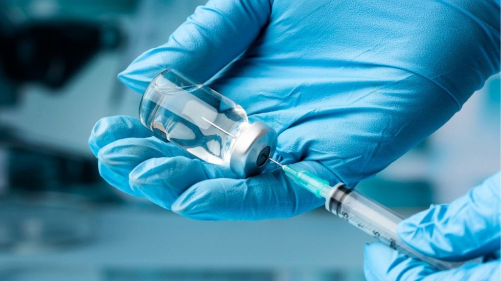 Doctor holding vaccine