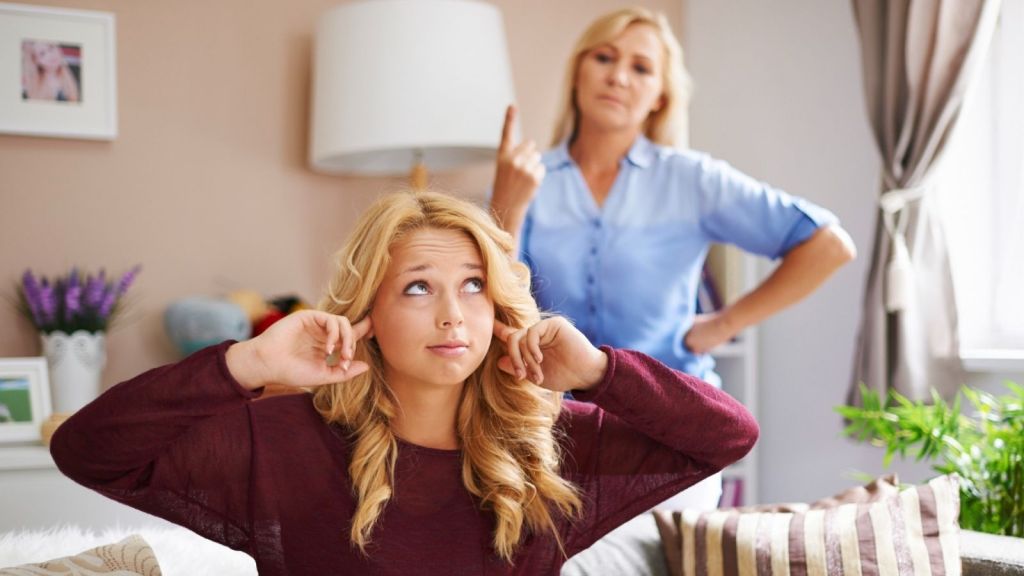 Teenage girl not listening to parent