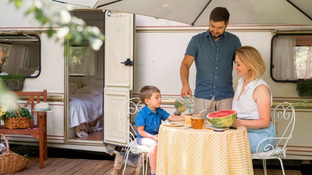 Family eating outside RV
