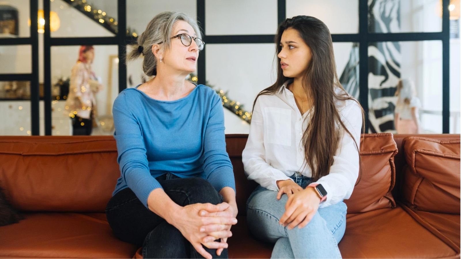 Her In Laws Offered $10,000 for the Wedding—Then Demanded Total Control of the Guest List Two women arguing on a couch