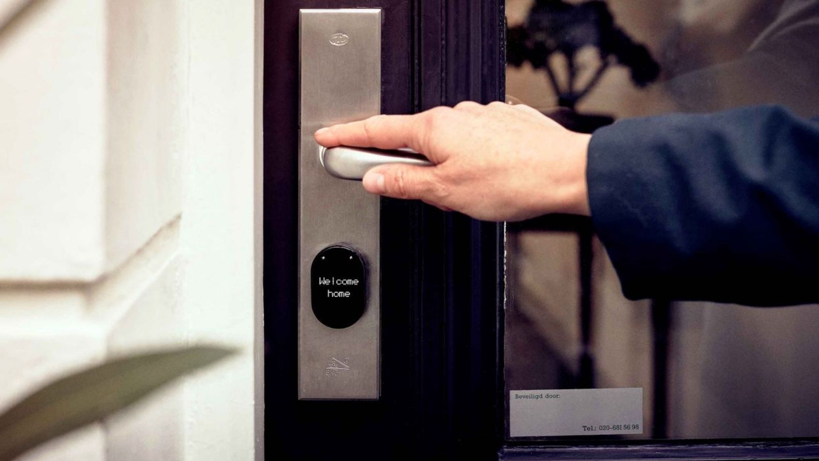 Man entering house with electronic lock
