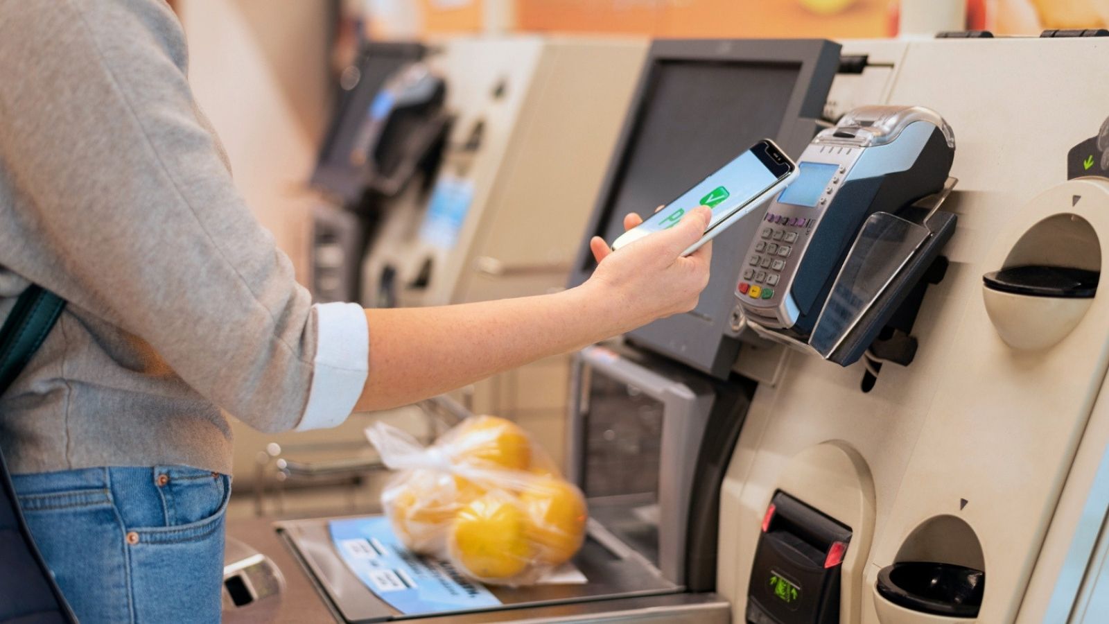 Woman using self checkout