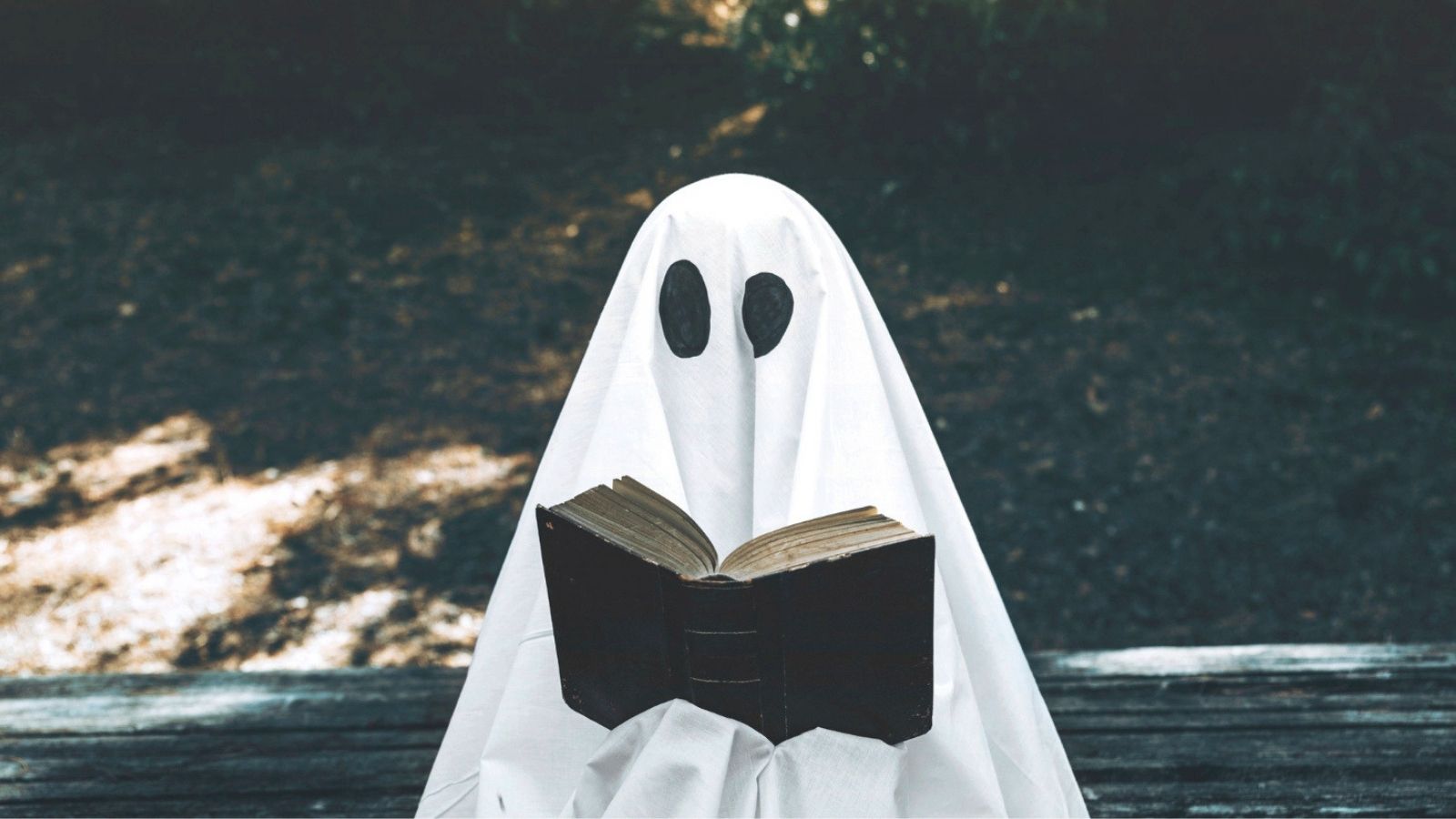 Ghost enjoying a book outside