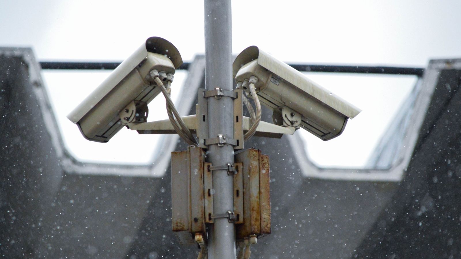 Two surveillance cameras on a pole