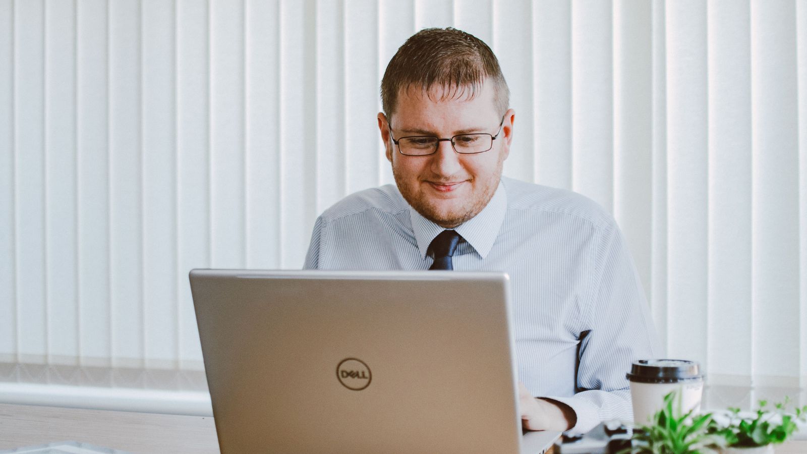Man in office working on a laptop