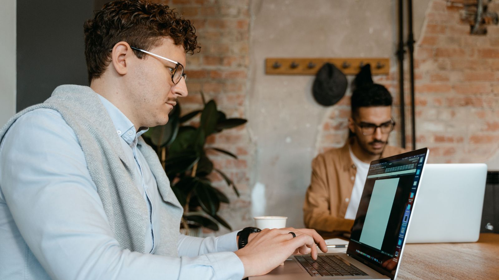 A New Boss Tried to Micromanage His Team—Until His Best Employees Handed In Their Resignations man working on laptop in office