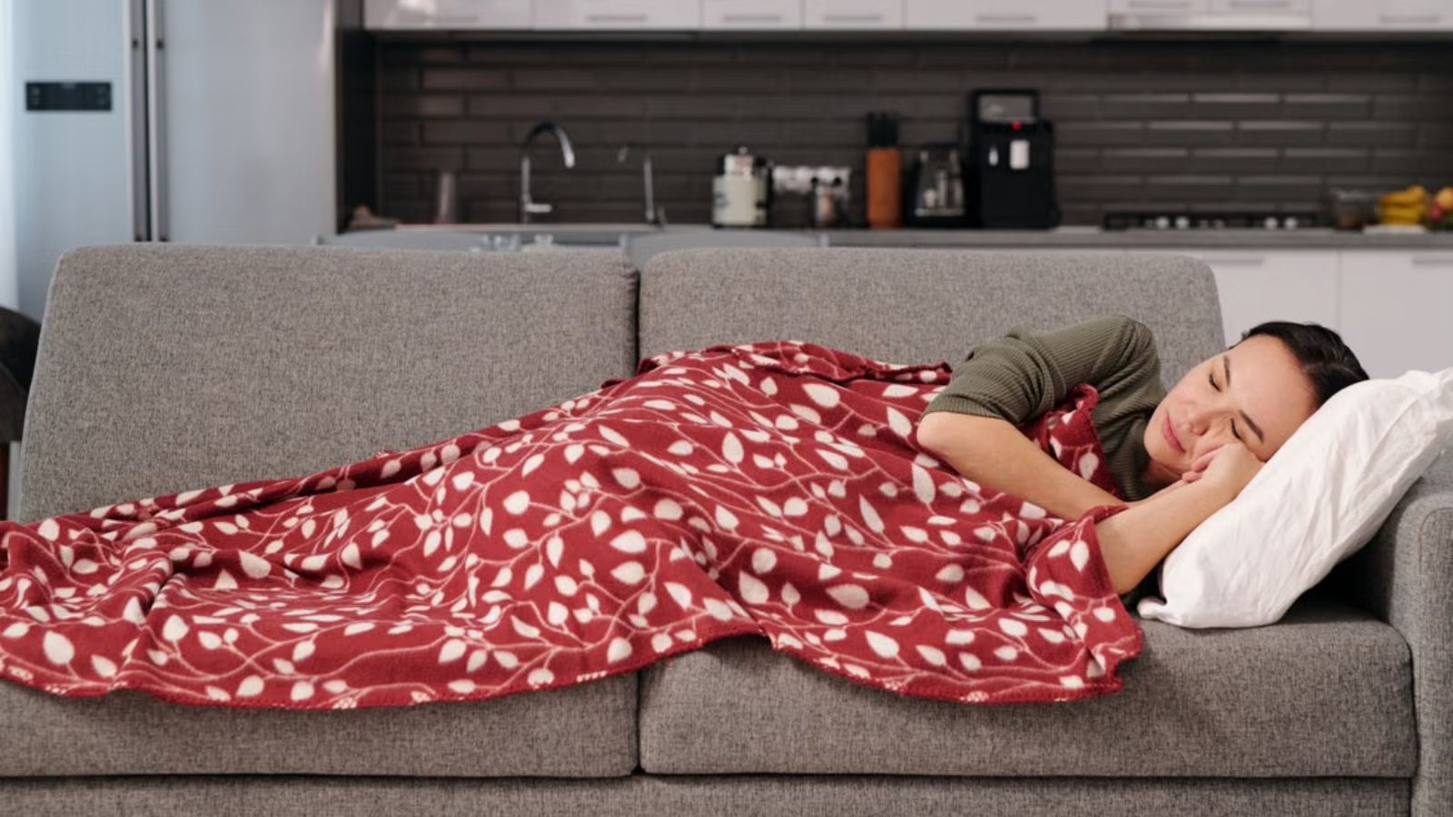 You Woke Me Up!: Roommate Claims Shared Living Room as Bedroom—Then Yells at Her for Walking Through Woman sleeping on the couch near the kitchen