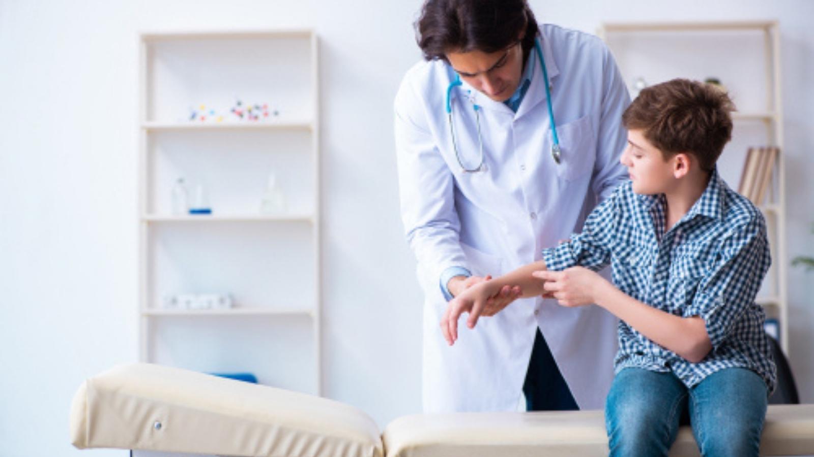 Doctor looking at wrist