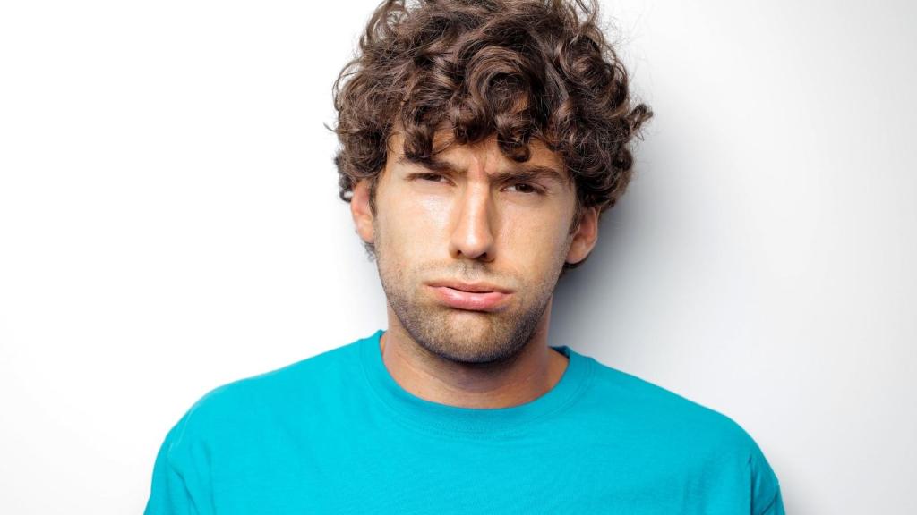 annoyed college student in blue shirt