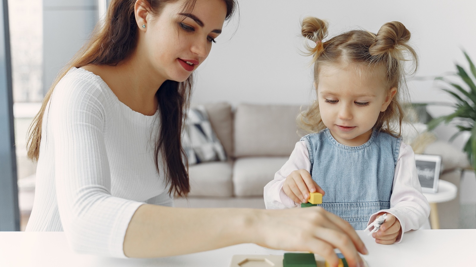 woman babysitting a young girl