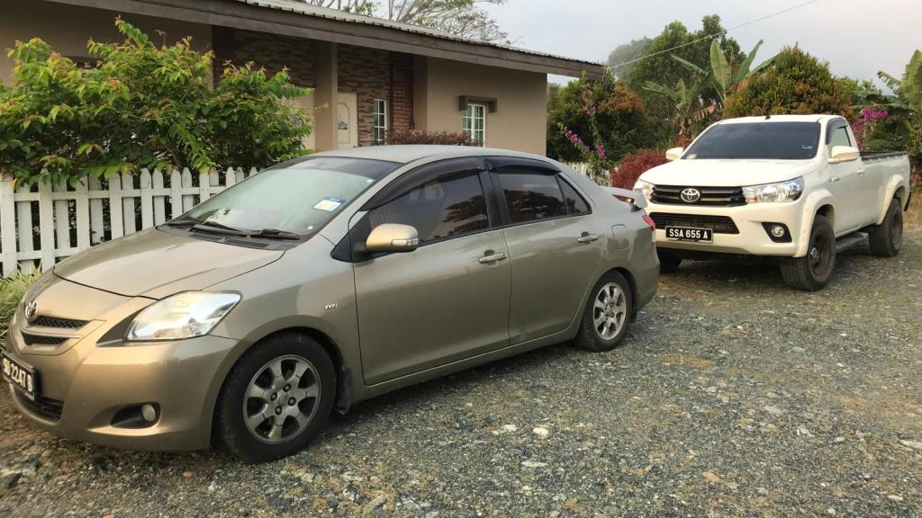 two cars parked in a driveway
