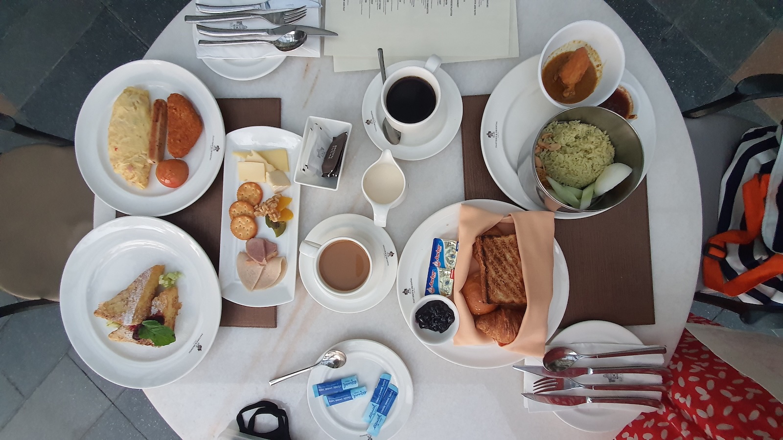 Hotel Guest Complains About a Breakfast Mix Up, Then Gets Angry When the Employee Makes It Free hotel breakfast on a table overhead
