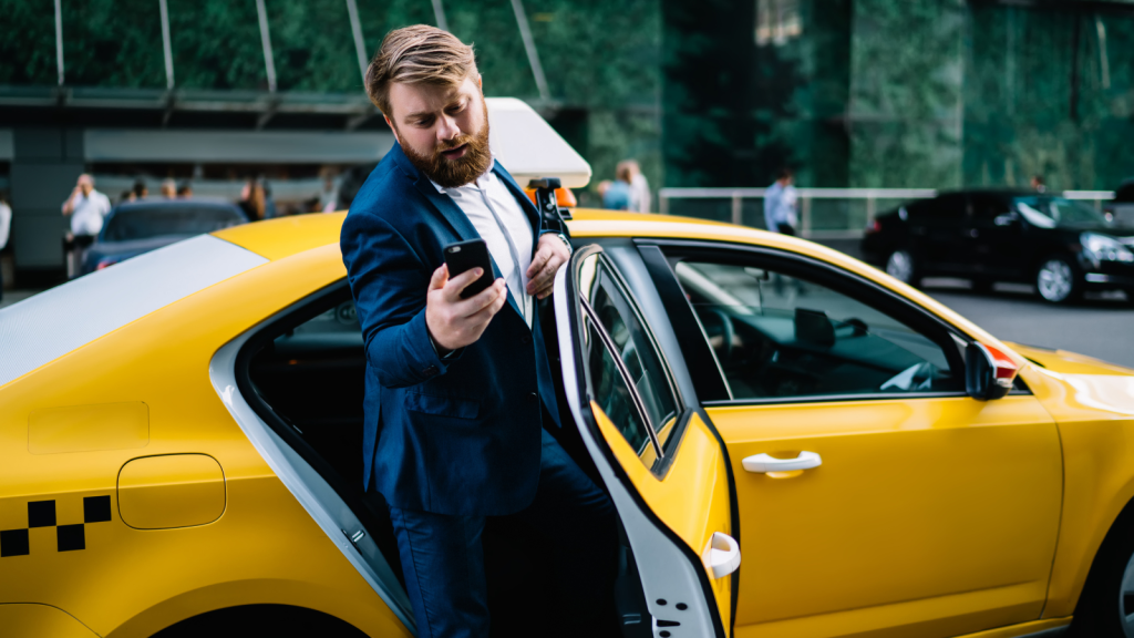 His Manager Wouldn’t Approve A Rental Car While He Was Traveling, But His Unusual Solution Made Sure He Still Reached The Office busy businessman getting out of cab