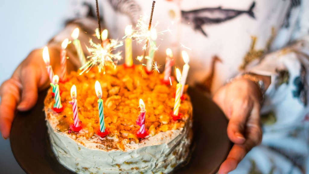 birthday cake with candles lit