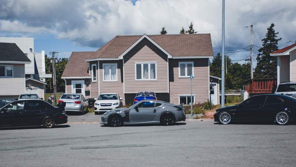 cars parked in front of house