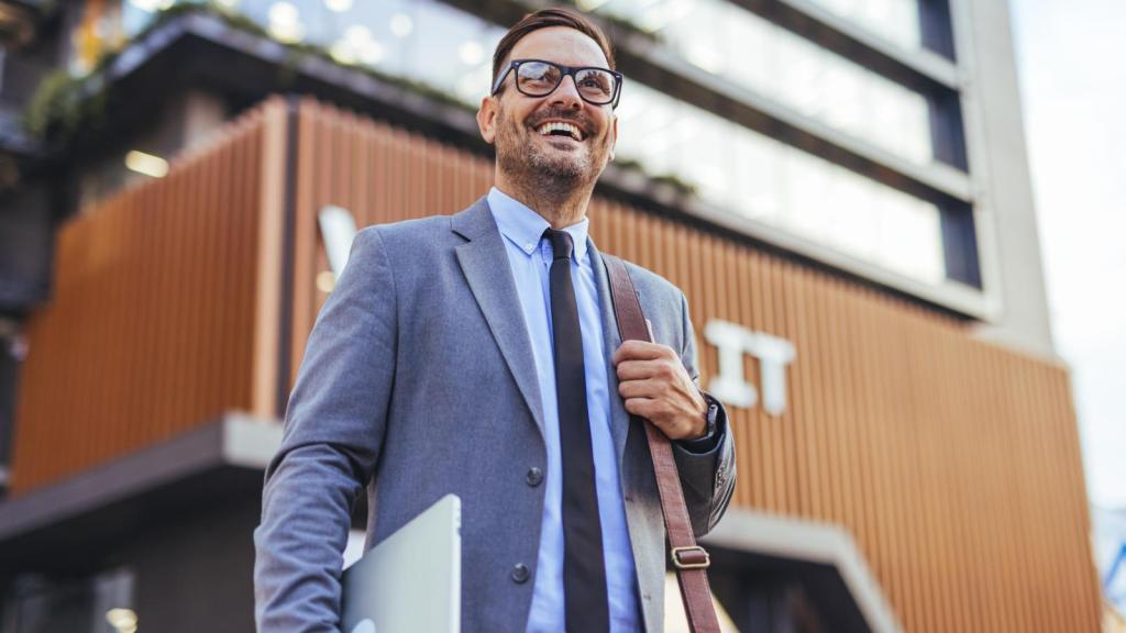 man walking out of an office building