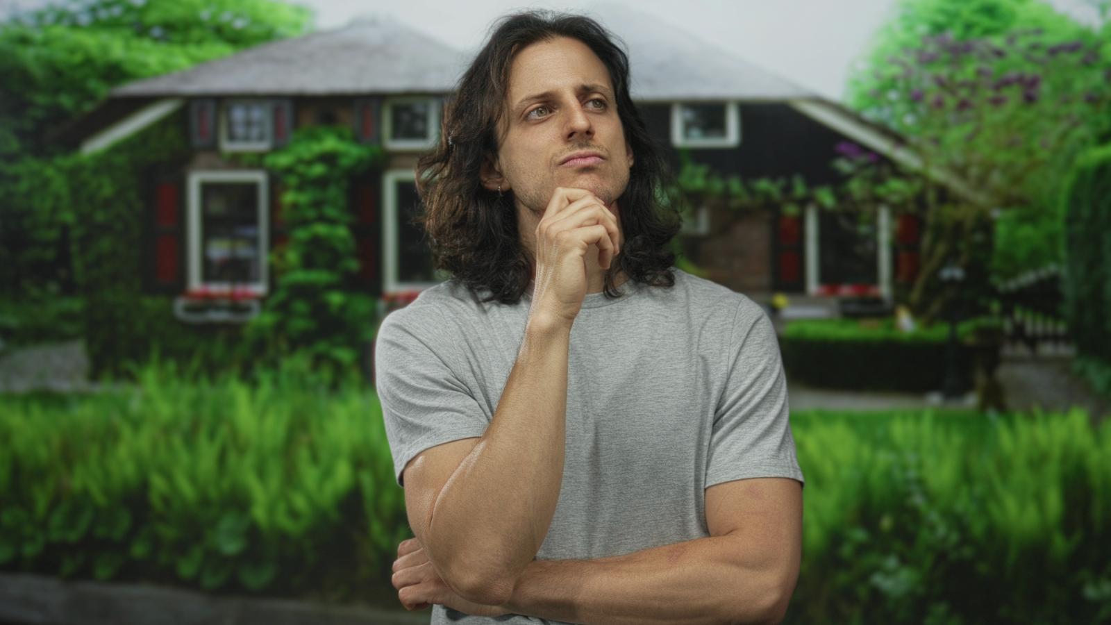 man in front of a house