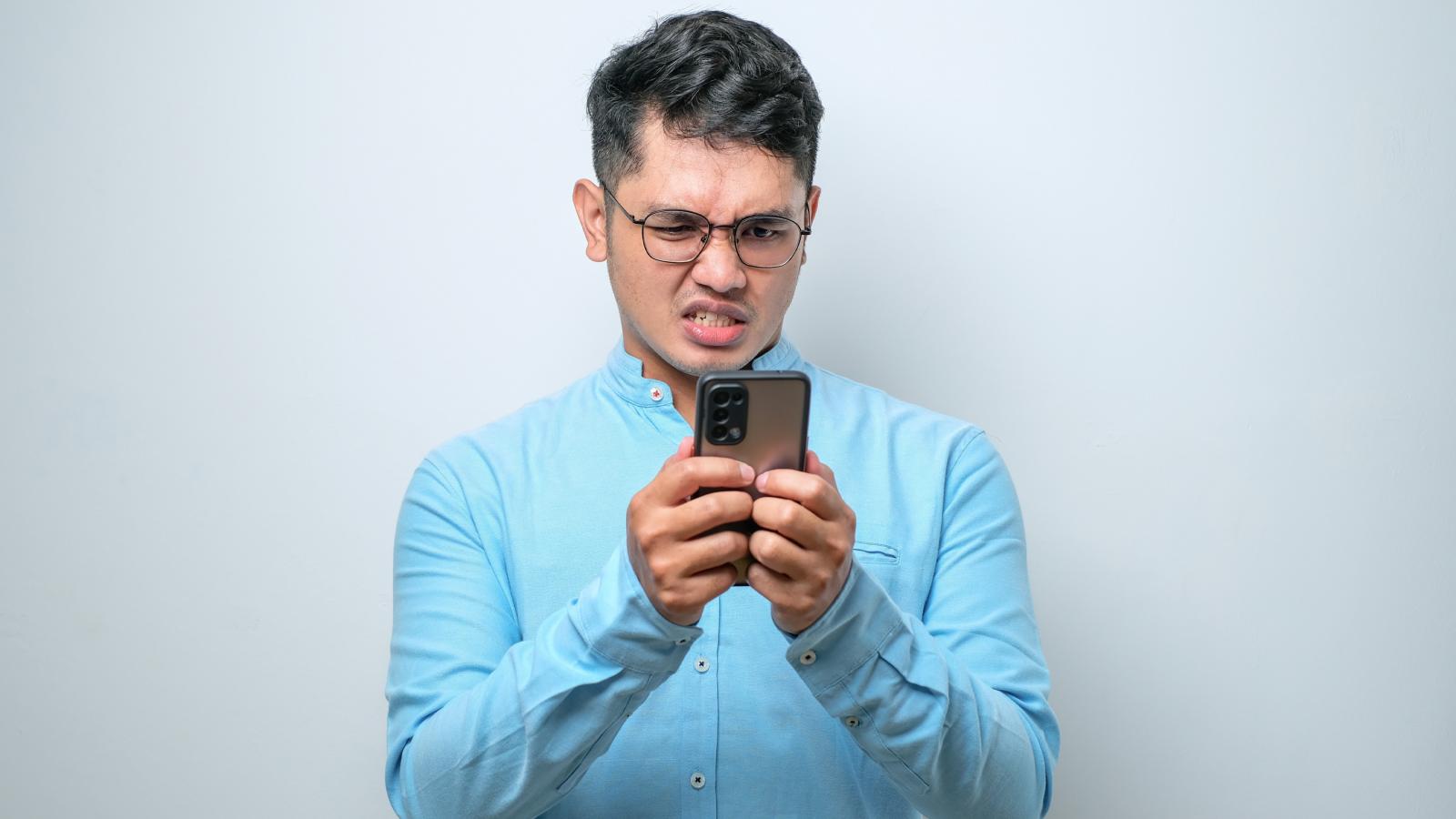 man looking at his phone