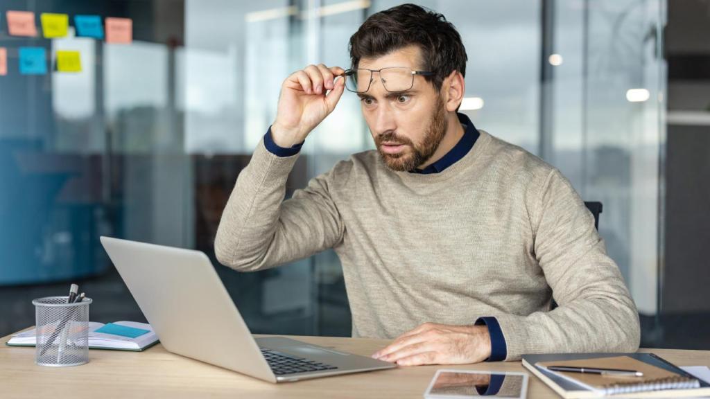 man looking at his computer